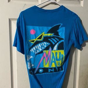 Blue tee shirt with a shark on the back